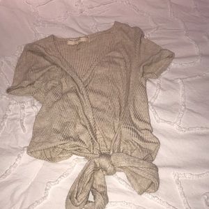 cropped tee with a tie at the bottom